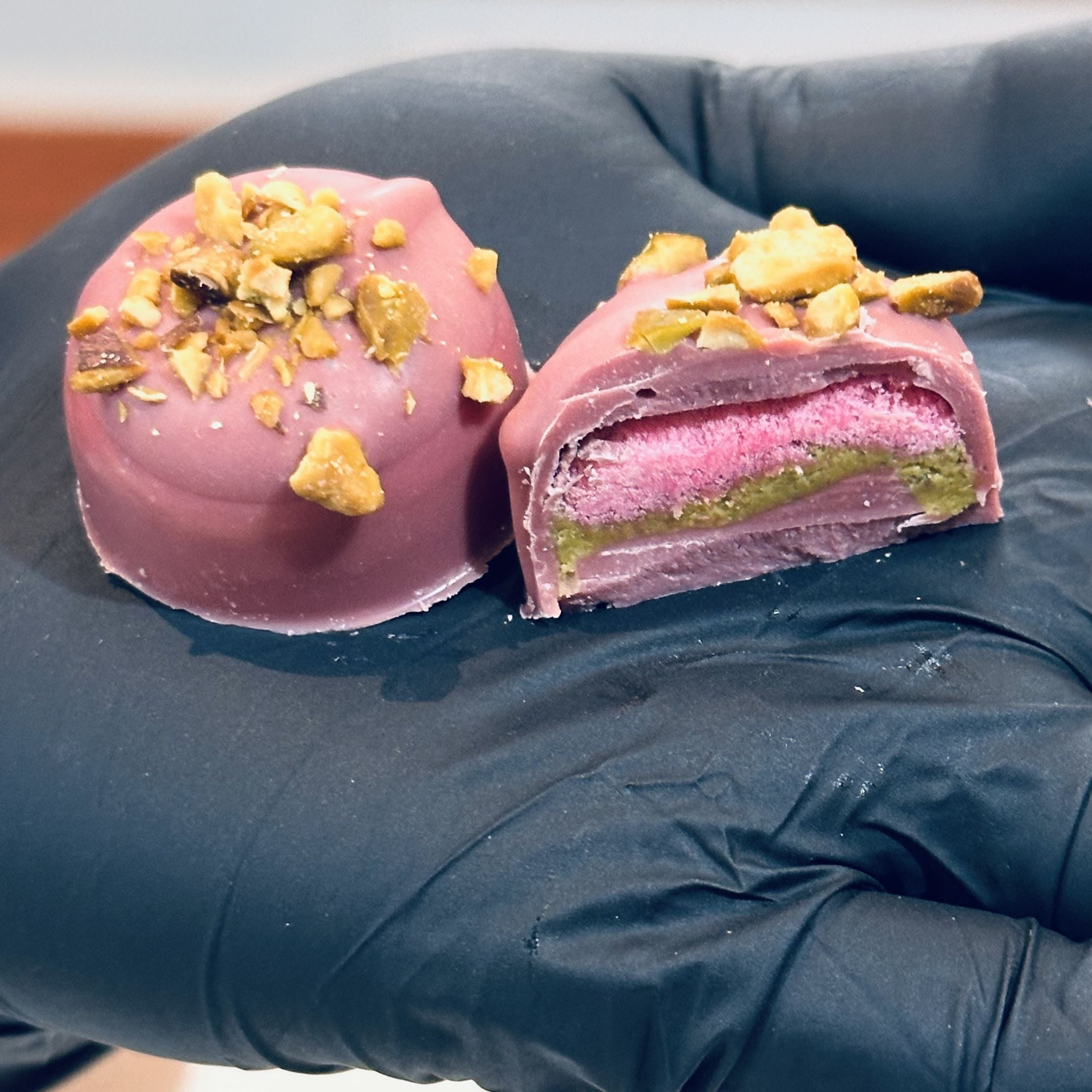 Chocolate On Purpose Ruby Pistachio Truffles with layers of Pashmak (persian ferry floss) and creamy pistachio butter, dipped in pink ruby chocolate, and topped with roasted pistachio nuts, pictured with ingredients. A delicious Valentine’s Day gift idea