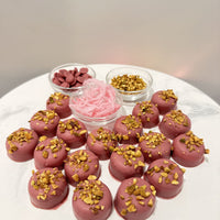 Chocolate On Purpose Ruby Pistachio Truffles with layers of Pashmak (persian ferry floss) and creamy pistachio butter, dipped in pink ruby chocolate, and topped with roasted pistachio nuts, pictured with ingredients. A delicious Valentine’s Day gift idea