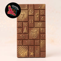 Warruyarra (to count in Wiradjuri language) milk chocolate advent calendar bar with Munthari (Muntrie Berry), 24 numbered windows with gold lustre dust. Chocolate On Purpose logo of Eagle, with Spirit within.