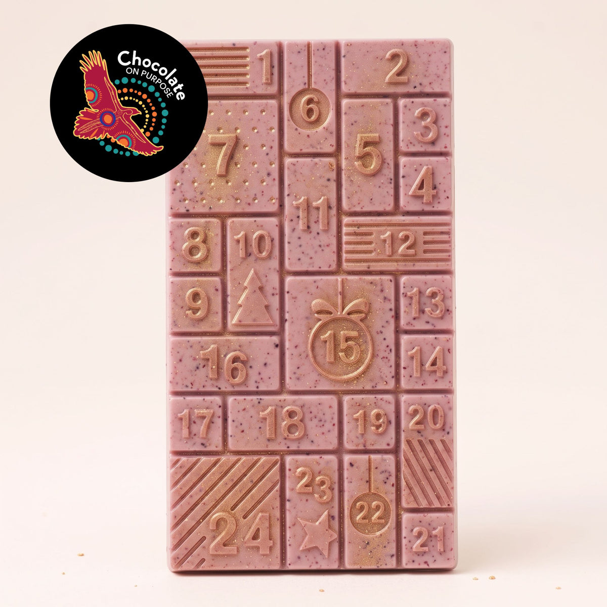 Warruyarra (to count in Wiradjuri language) white chocolate advent calendar bar with Ooray (Davidson Plum), 24 numbered windows with gold lustre. Chocolate On Purpose logo of Eagle, with Spirit within.