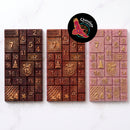 Warruyarra (to count in Wiradjuri language) chocolate advent calendar bars in dark chocolate with Gulalung (finger lime), milk chocolate with Munthari (muntrie berry) and white chocolate with Ooray (Davidson plum), each with 24 numbered windows and gold lustre. Chocolate On Purpose logo of Eagle, with Spirit within.