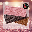 Merry Christmas chocolate bars, white chocolate with Ooray (Davidson Plum), dark chocolate with Gulalung (Finger Lime) and milk chocolate with Munthari (Muntrie Berry), embossed with “Merry Christmas” and snowflakes, stacked on a pink glitter background. Chocolate On Purpose logo of Eagle, with Spirit within in the top right hand corner.