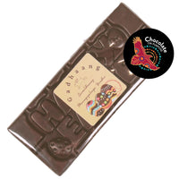 Happy Easter chocolate bar in clear wrapper, creamy dark chocolate with native botanical Davidson Plum and raised “HAPPY EASTER” lettering, with Wiradjuri Easter Greeting on Label, and Chocolate On Purpose logo on image