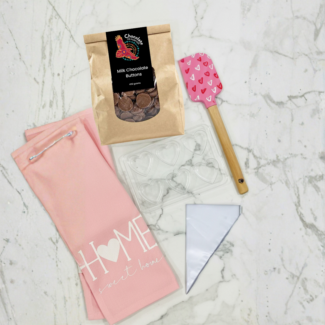DIY Chocolate Making Kit flat lay with pink 