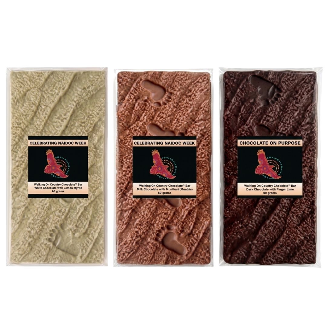 Three Walking On Country bush food chocolate bars side by side - Girri Girri lemon myrtle, Munthari muntrie berry, Gulalung finger lime - NAIDOC 2026 Chocolate On Purpose