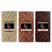 Three Walking On Country bush food chocolate bars side by side - Girri Girri lemon myrtle, Munthari muntrie berry, Gulalung finger lime - NAIDOC 2026 Chocolate On Purpose