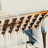 Chocolate dripping from mold tray.